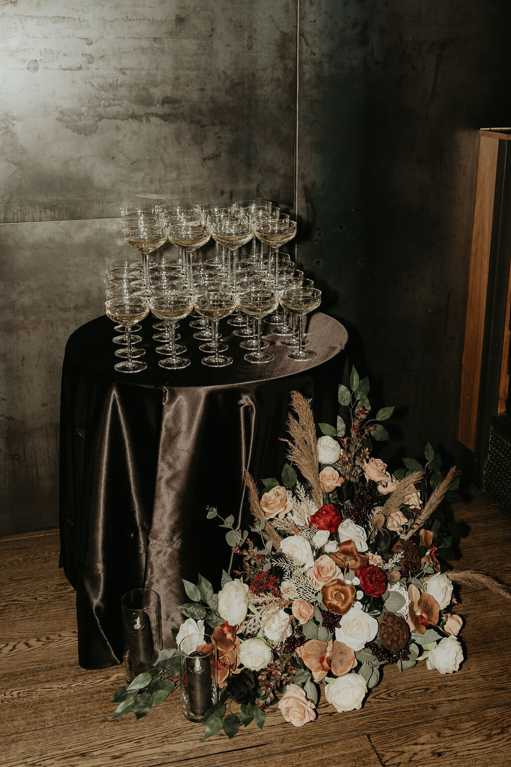 coupe-champagne-glasses-with-floral-arrangements