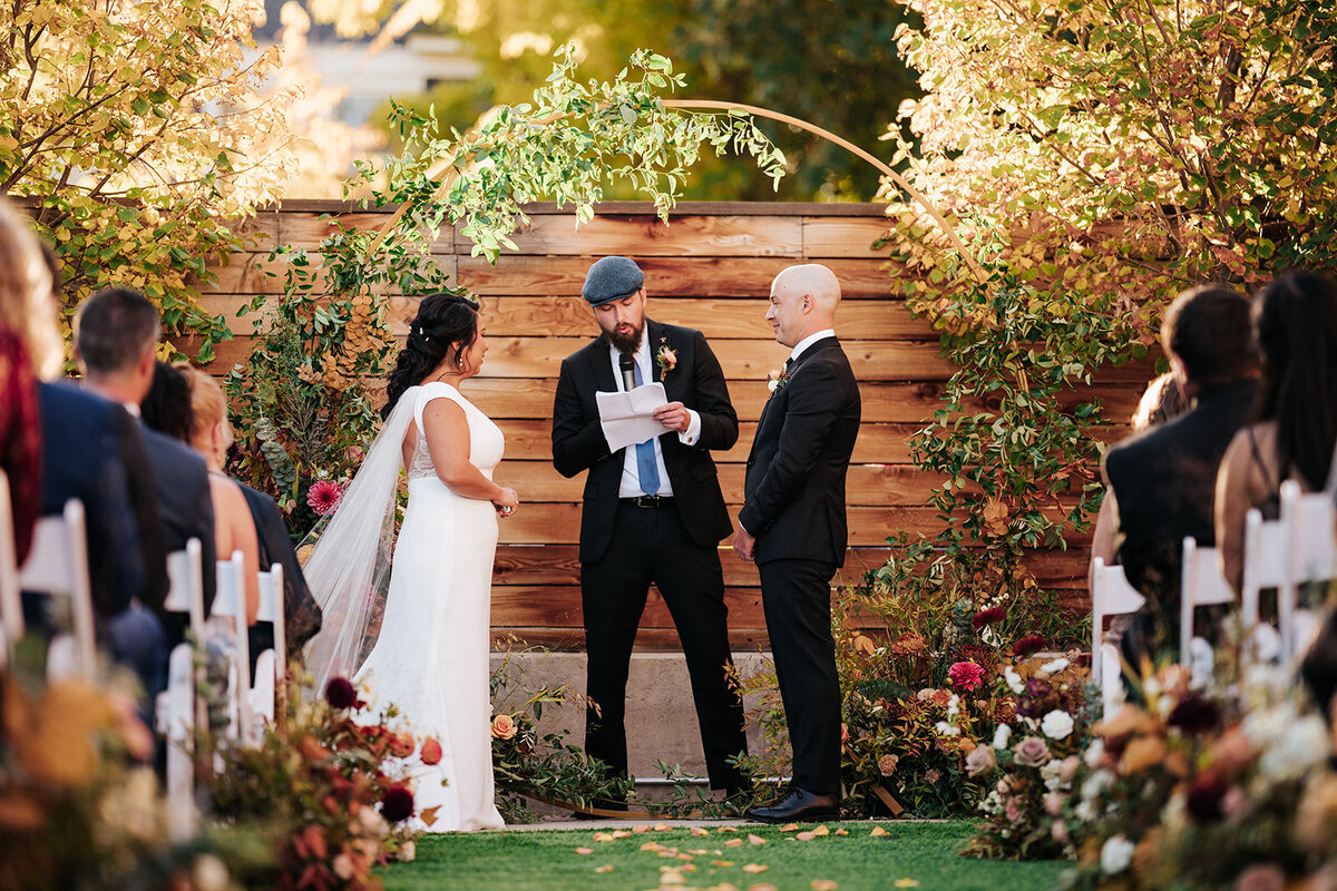 Bride and groom at fall wedding ceremony in Longmont, Colorado