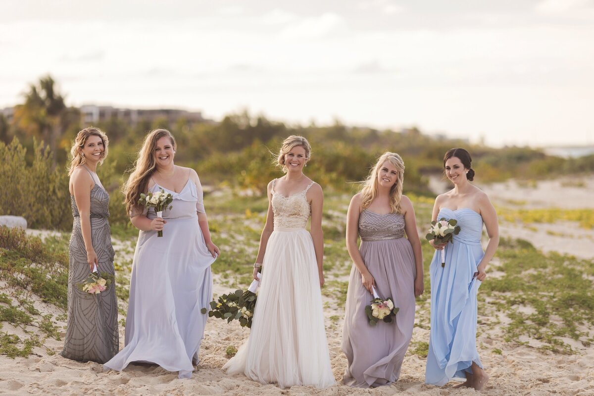 Editorial portrait of bridesmaids with bride on beach in cancun