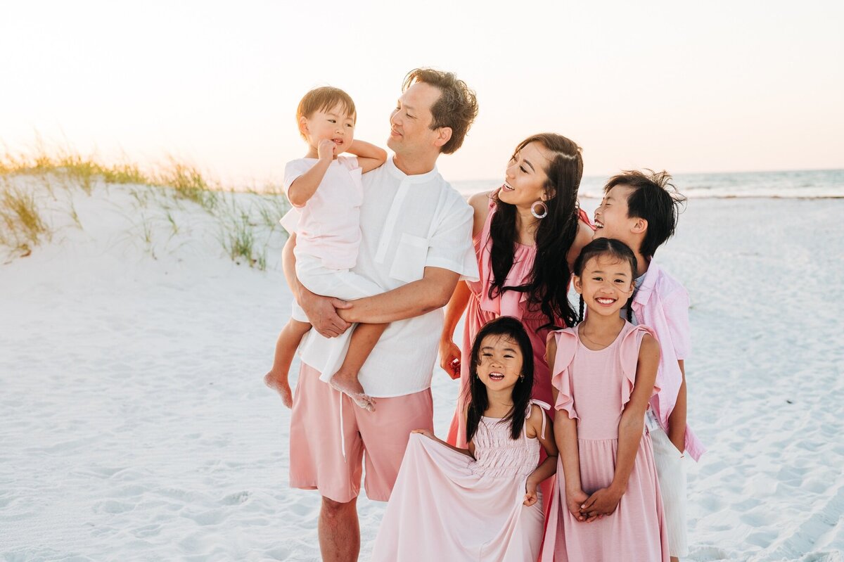 Beach portrait of family  wearing pink  at  Navarre Beach