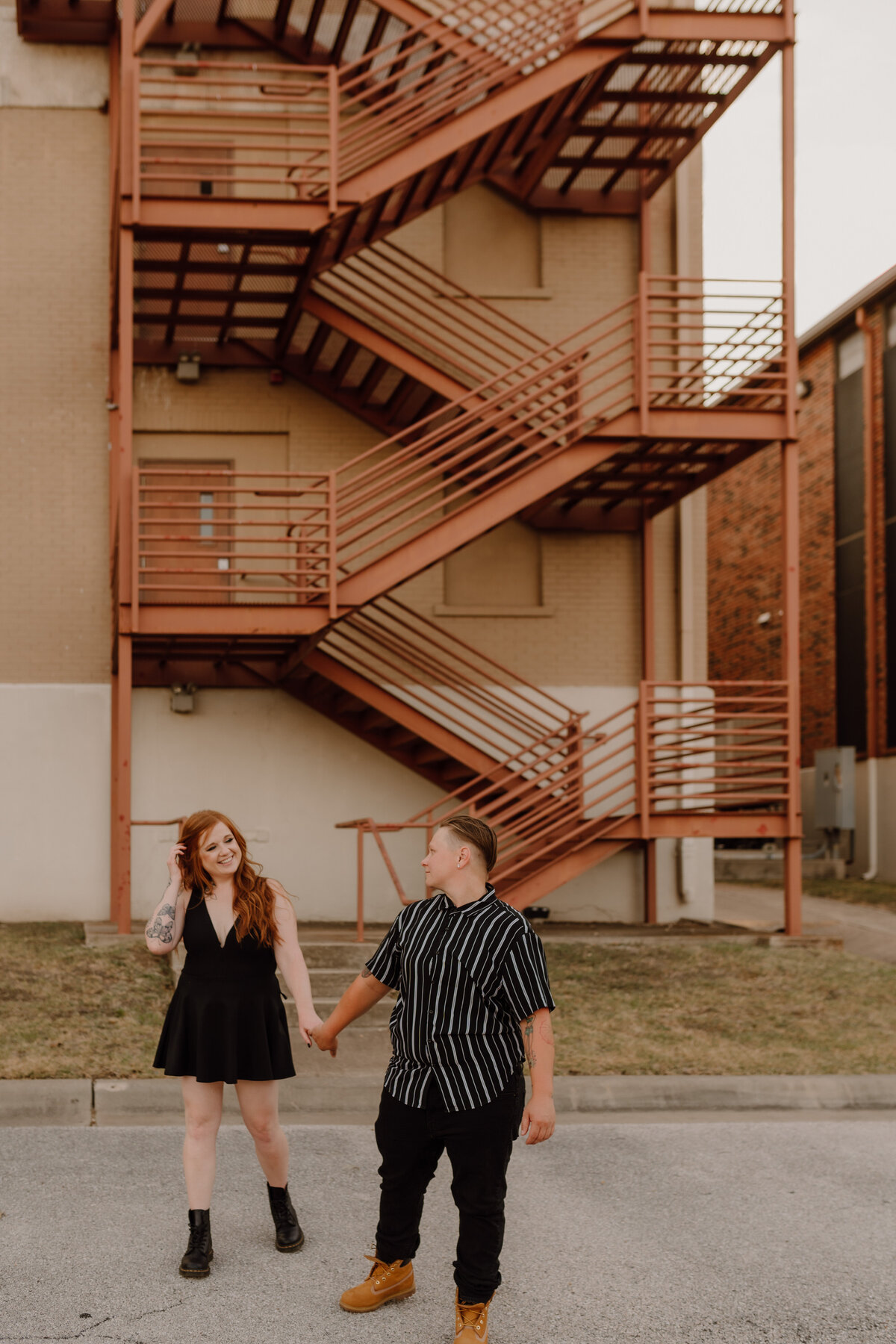 couple posing by staircase