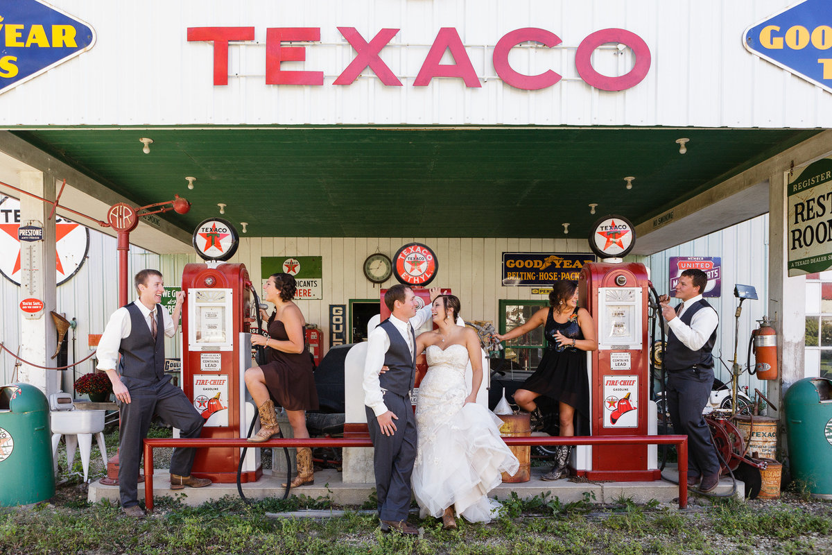 antique gas station decor at this texaco mock station for the wedding day