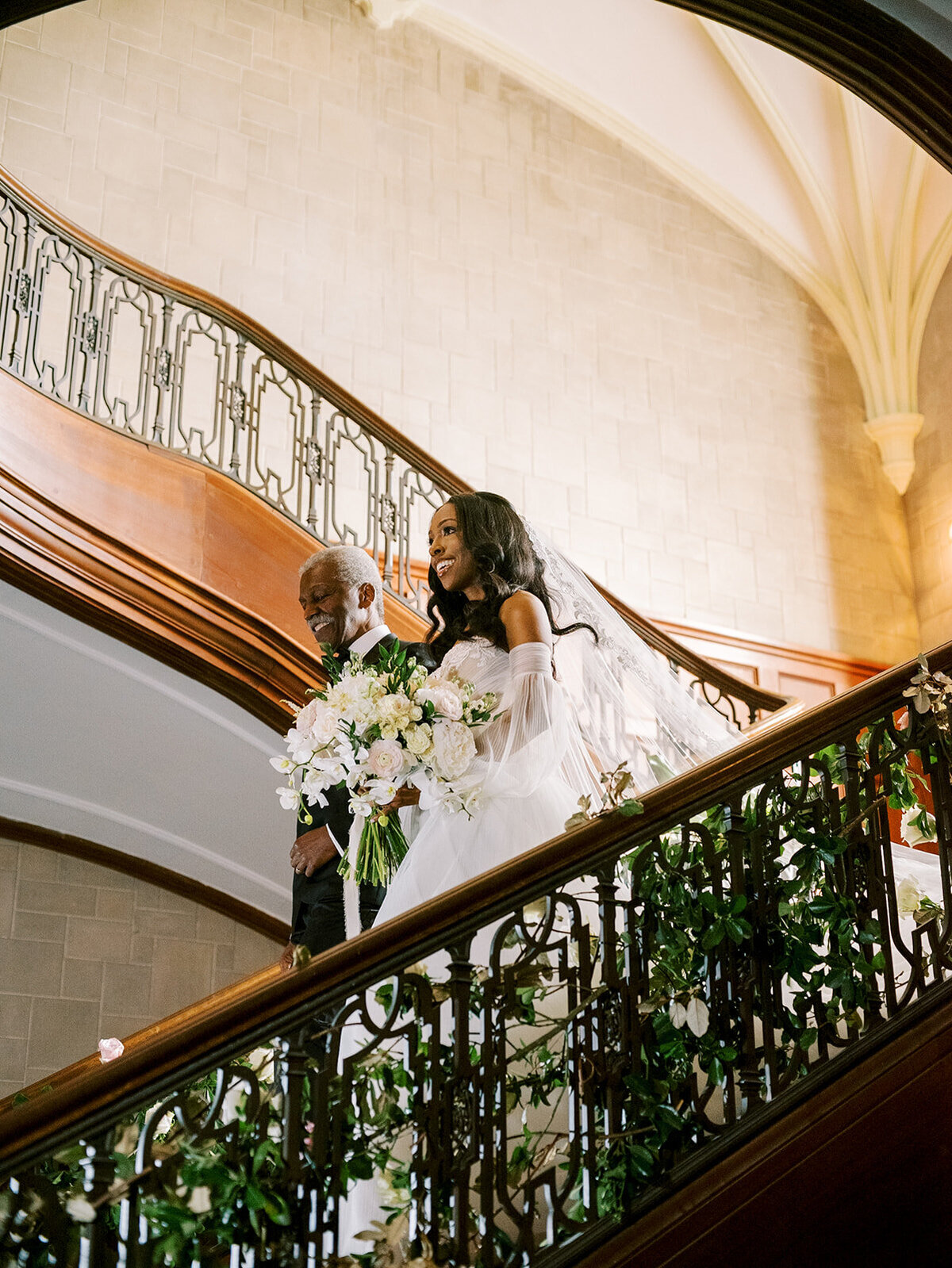 bride-and-father-of-the-bride-walking-down-callanwolde-staircase-elizabeth-austin-photography