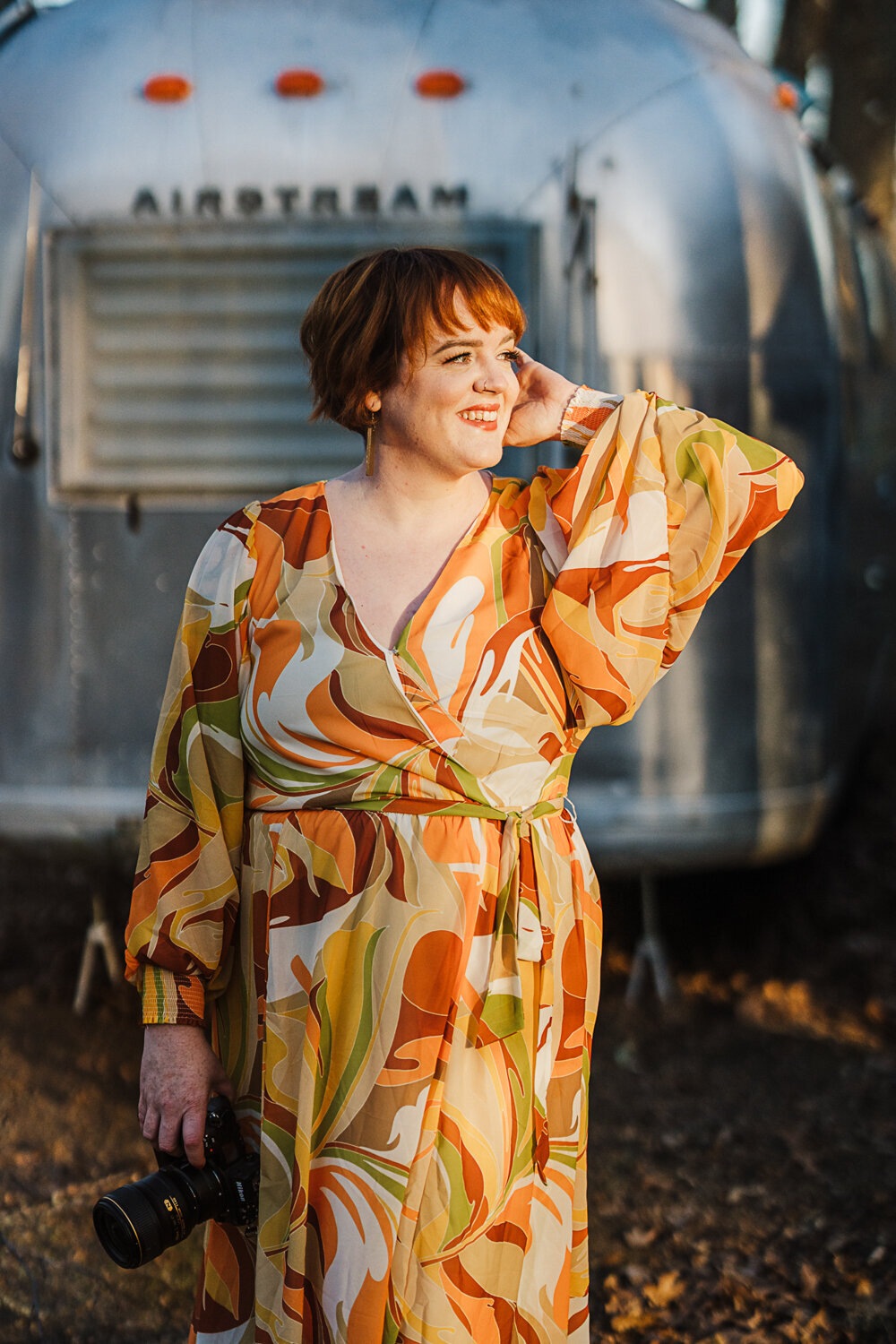 sunset headshots with boho dress in front of an airstream