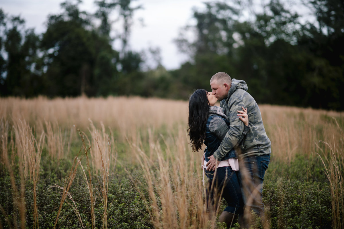 engaged couple kissing in bayonet farm session