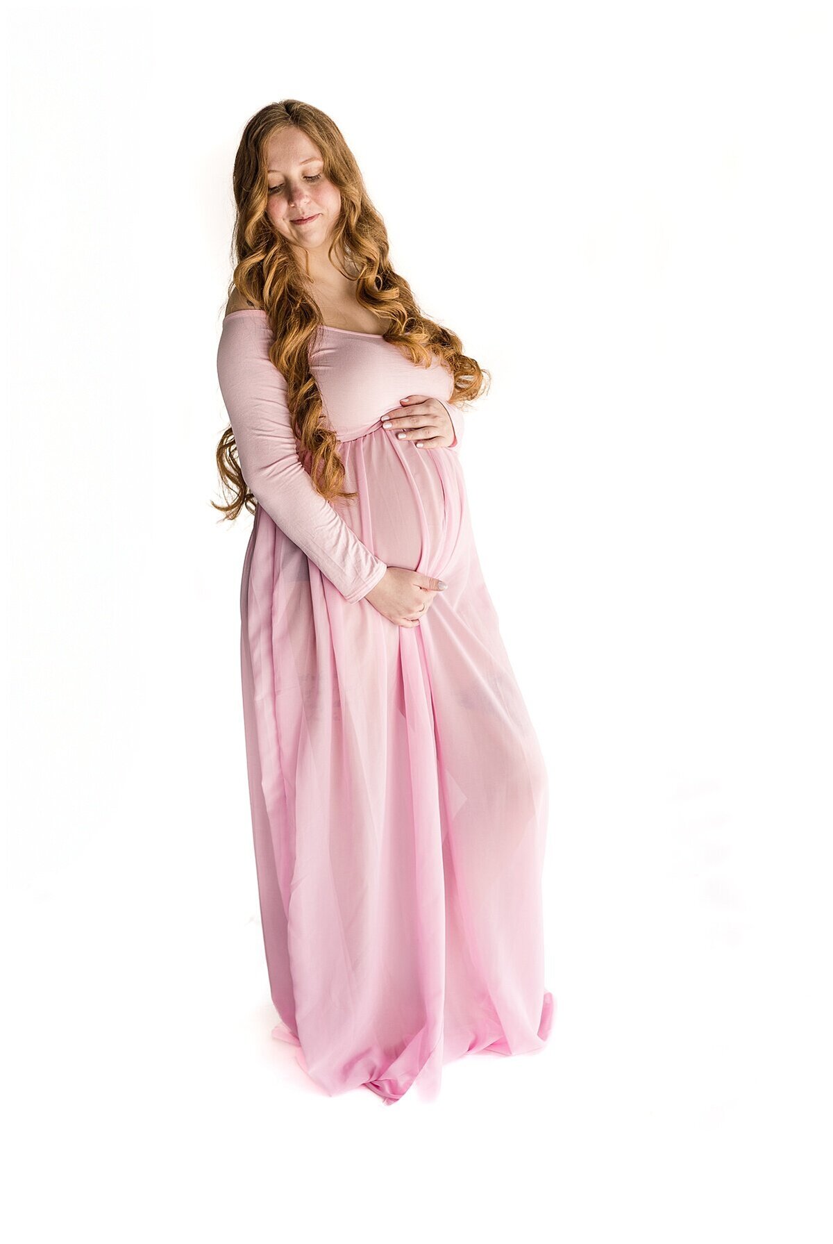 Maternity Session in Wexford PA where mom is showing off her belly in a pink dress