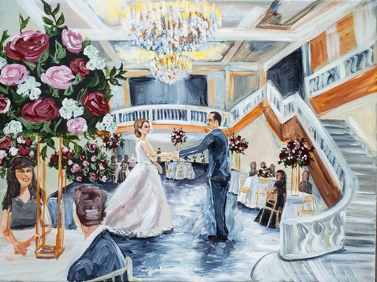 First dance live wedding painting at the Museum for Women in the Arts in Washington, DC. Couple in wedding attire dance under crystal chandelier.