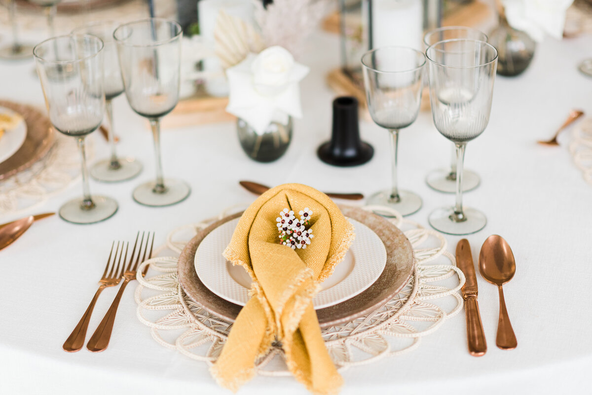 denver wedding photographer captures reception table decor for rocky mountain national park wedding with gold details