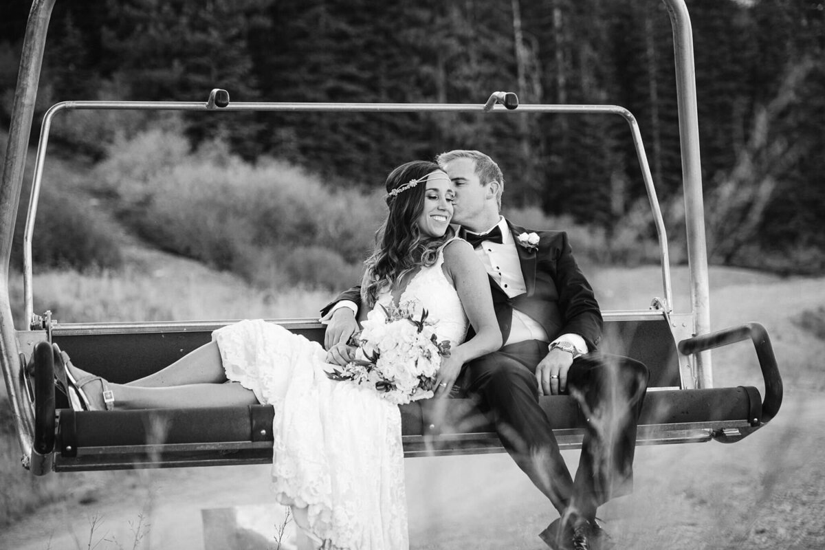 Ritz Carlton Tahoe bride and groom on chairlift black and white image