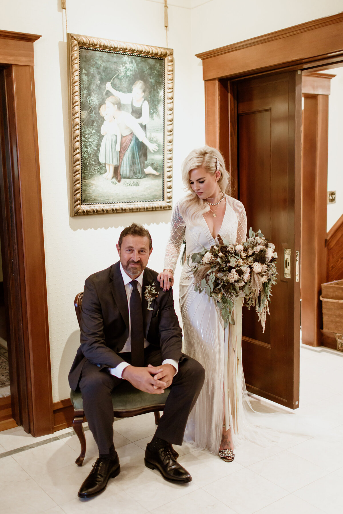 A beautiful indoor portrait of a couple in wedding attire captured by Fort Worth Wedding Photographer, Megan Christine Studio