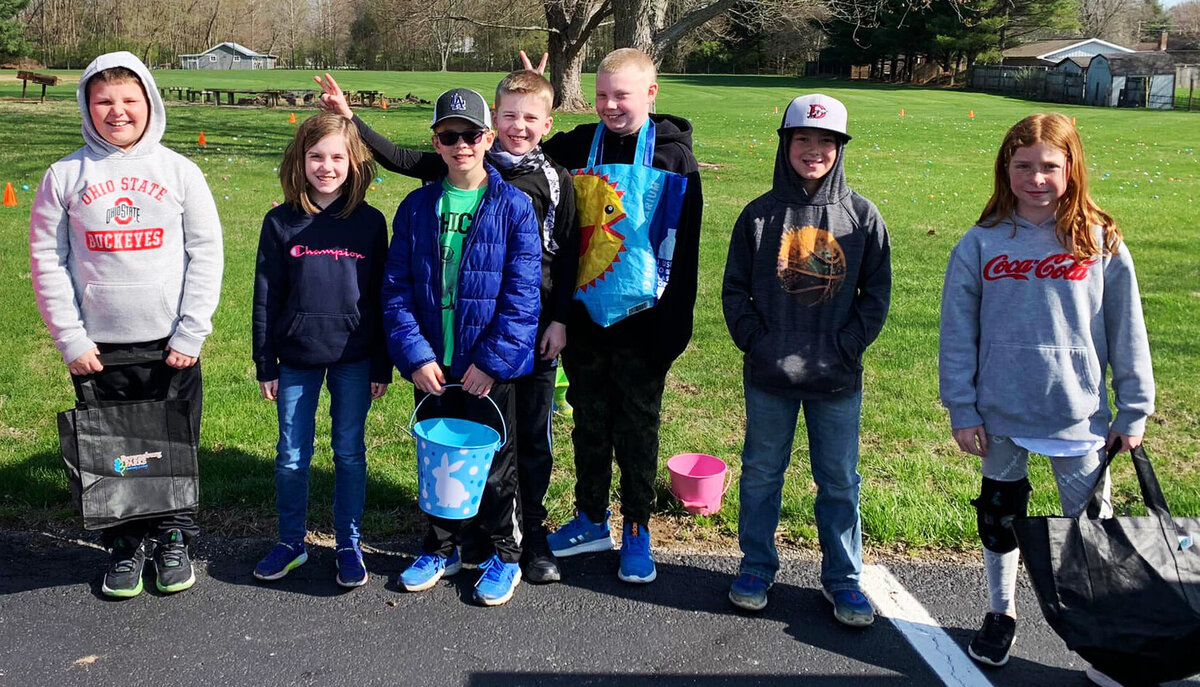 Children pose for a photo after an Easter Egg Hunt at Bartlett Chapel