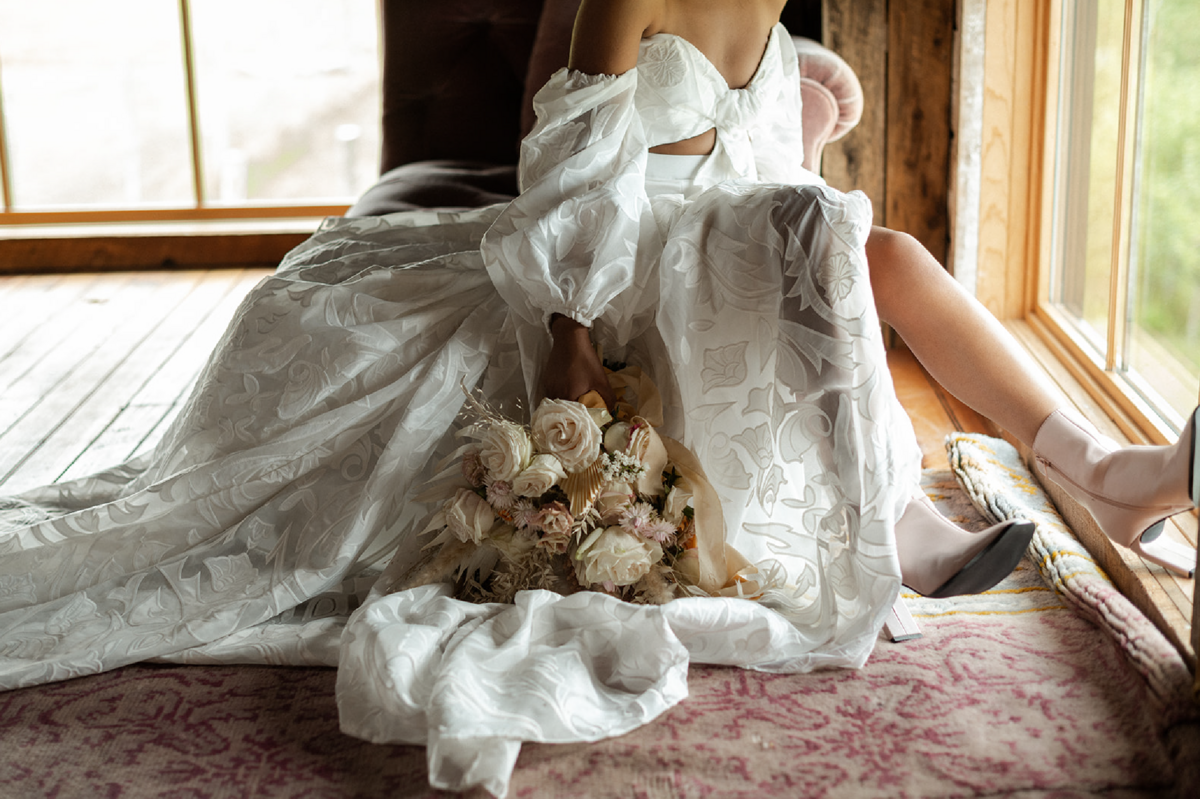 bride with flowers in vintage boots