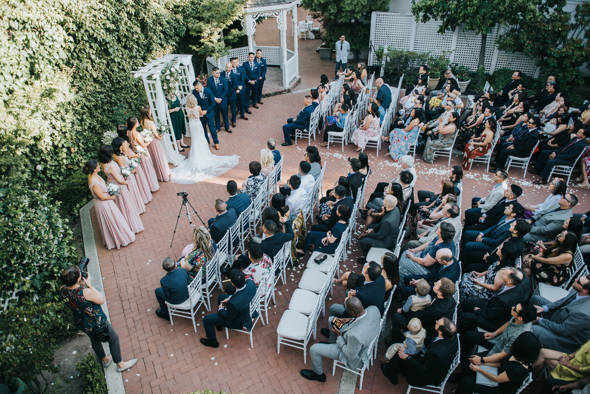 Our couple exchanges their vows on a Spring evening with their loved ones watching in our Gardens Courtyard.