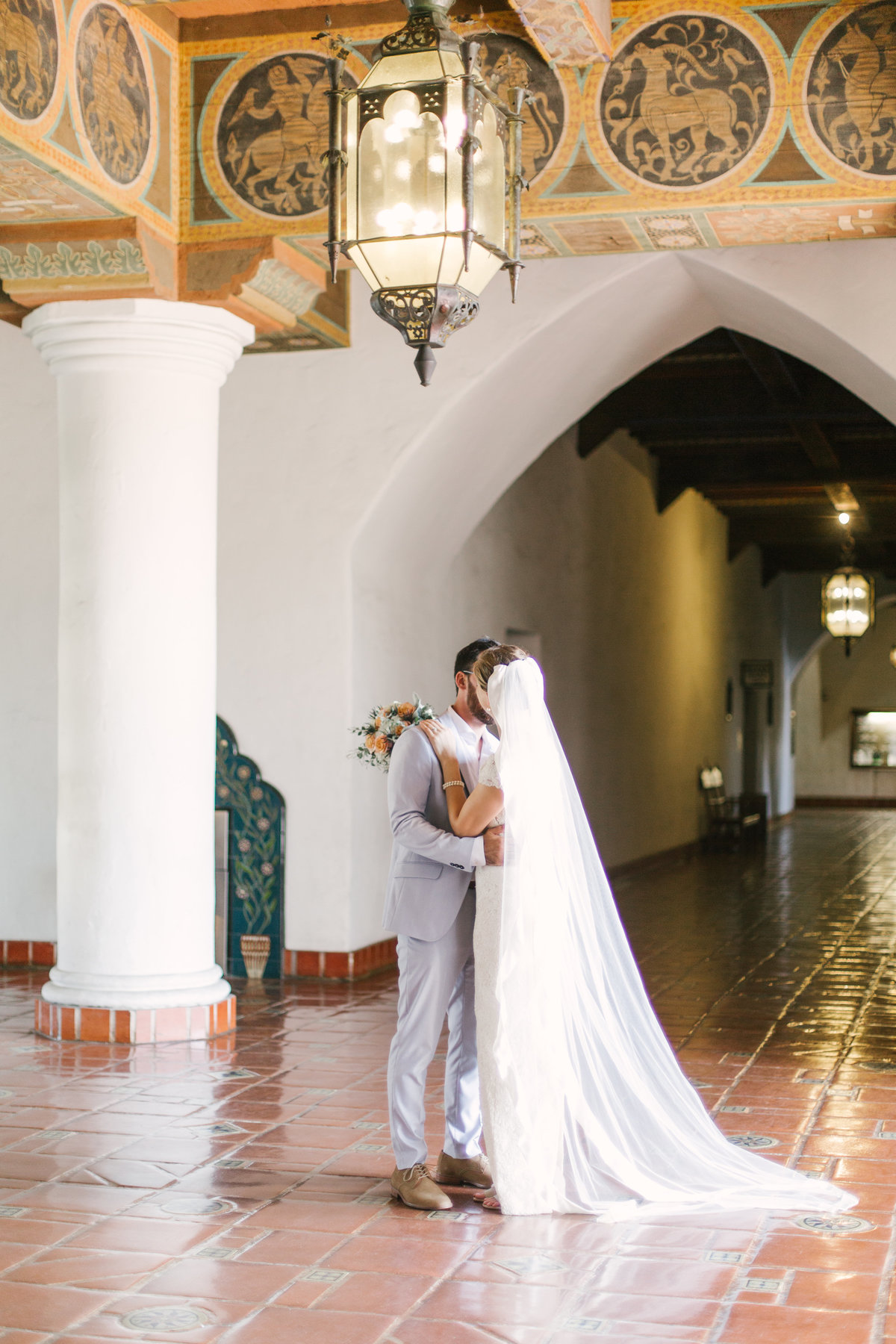 Groom kisses bride at Santa Barbara Courthouse wedding
