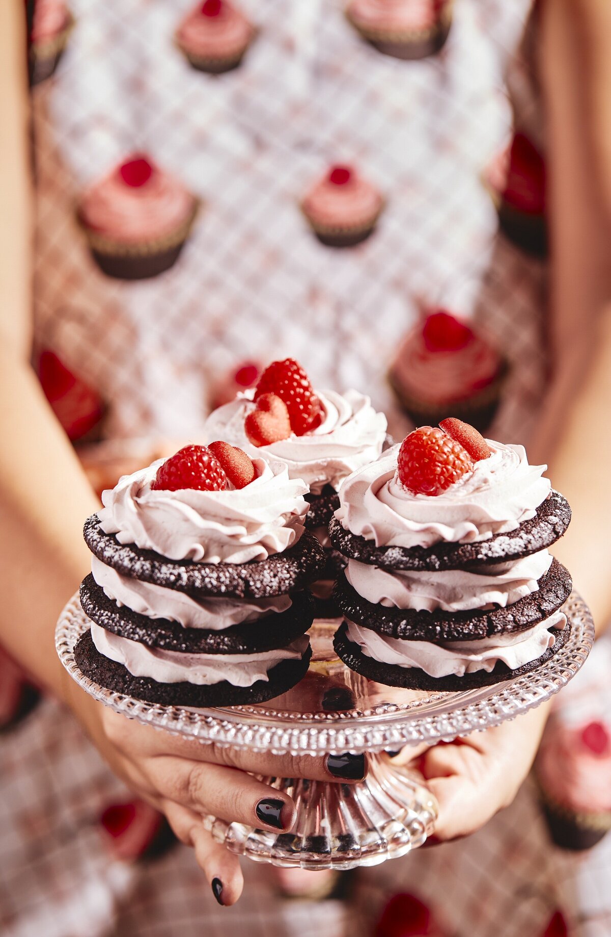 A double stacked ice cream sandwich with whipped cream and berries on top.