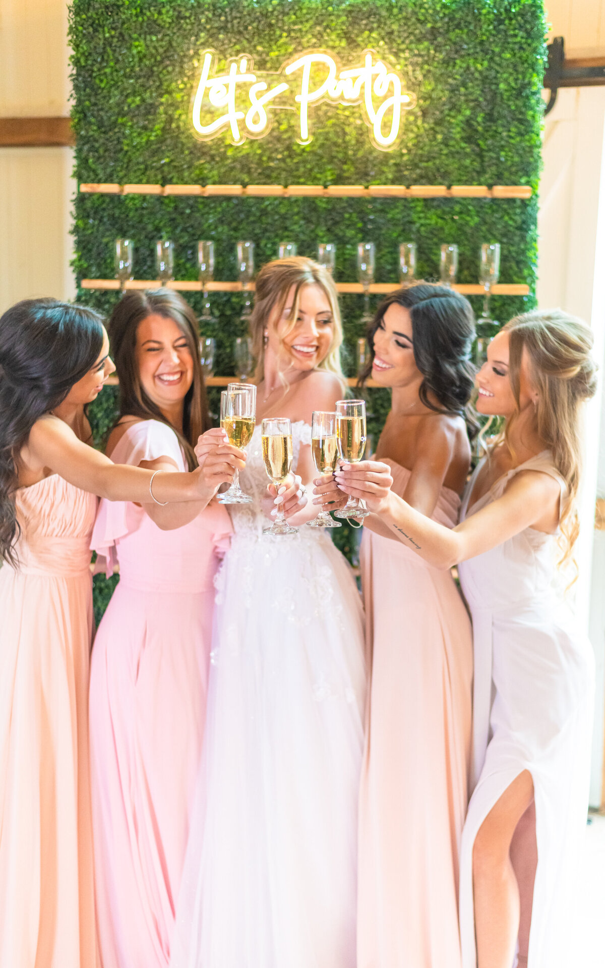 Bride and bridal party champagne toast