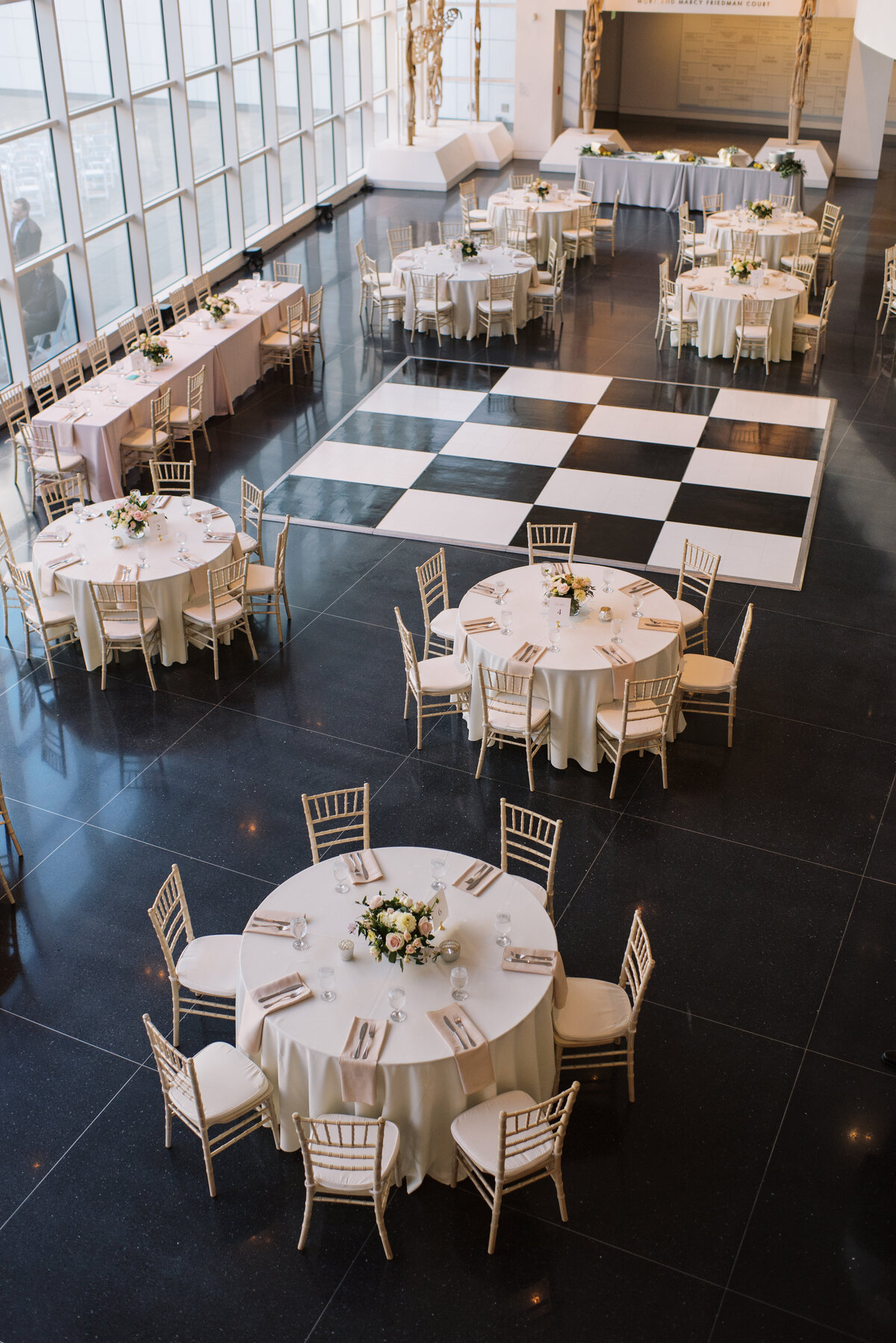 wedding tables at museum with dance floor in the middle