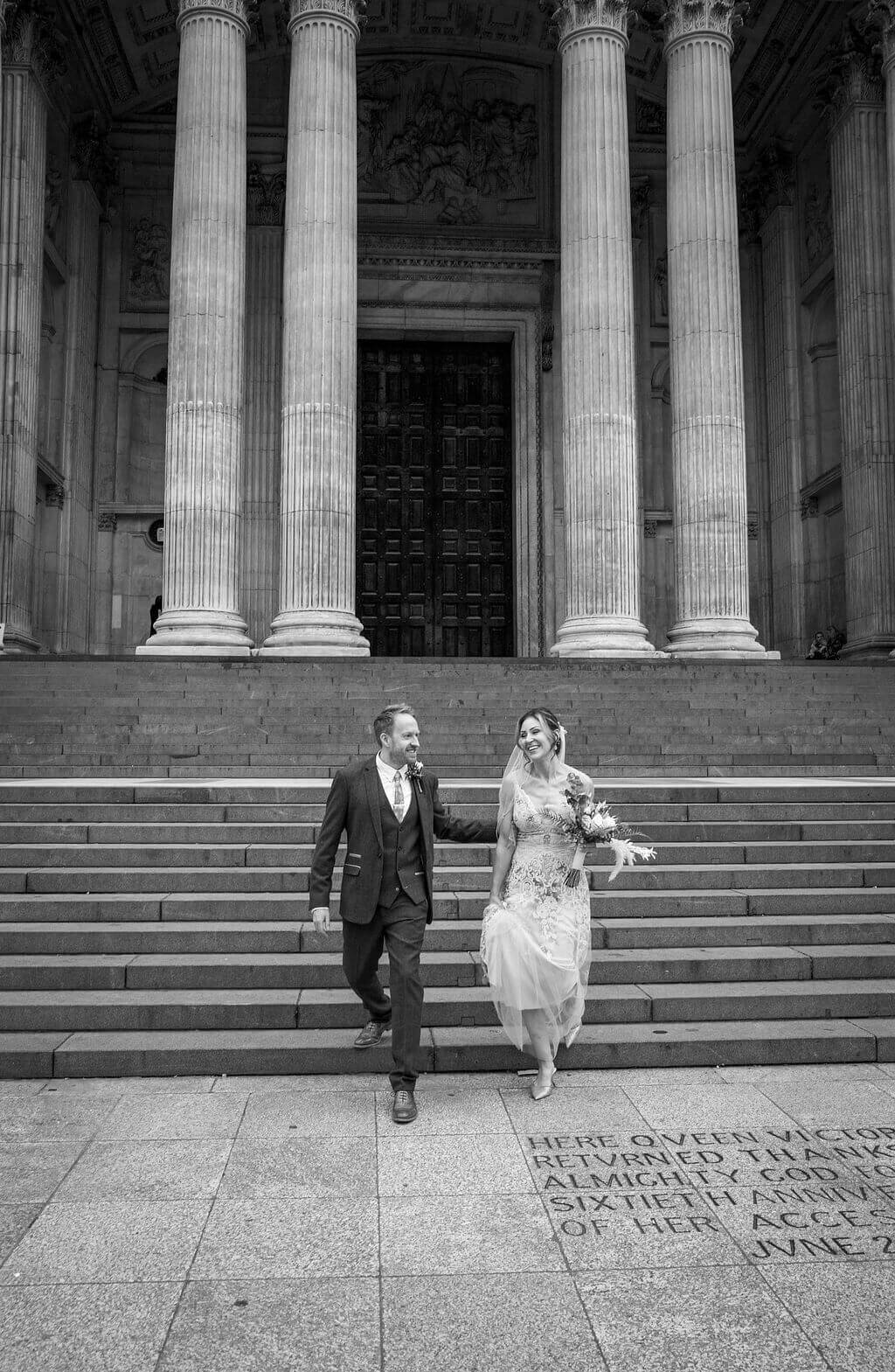 St Pauls wedding, bride and groom leaving down steps