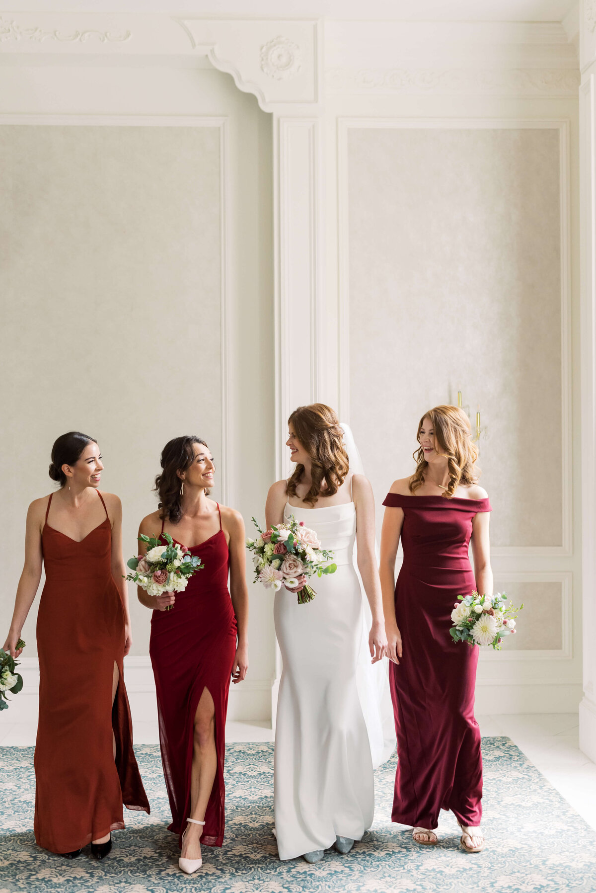 Bride with 3 bridesmaids wearing red dresses at Lord Nelson Hotel, Nova Scotia