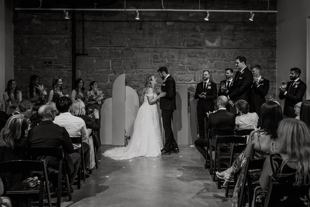 Wedding ceremony at The Pioneer, a historical industrial wedding venue in Calgary, featured on the Brontë Bride Vendor Guide.