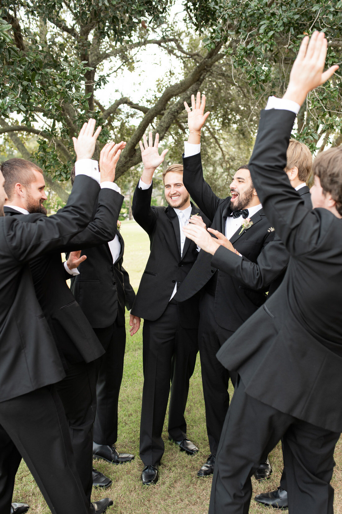 groom groomsmen huddle high five