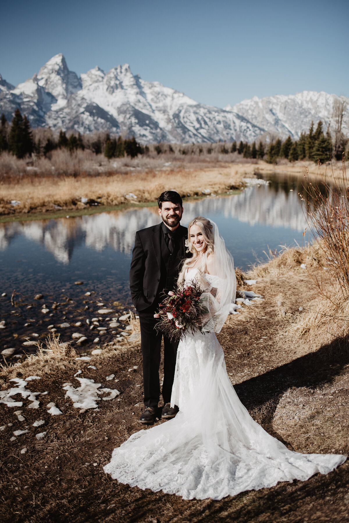 Jackson Hole Photographers capture bride and groom portraits in front of Tetons