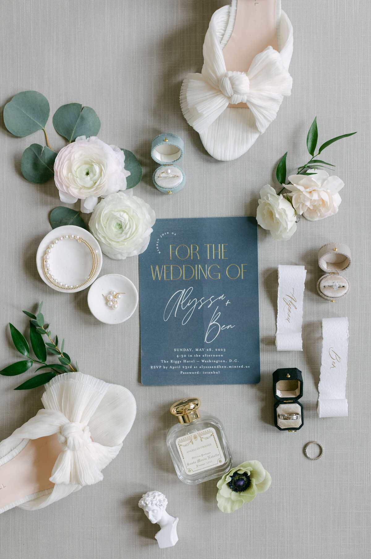 An invitation sits on a soft background.