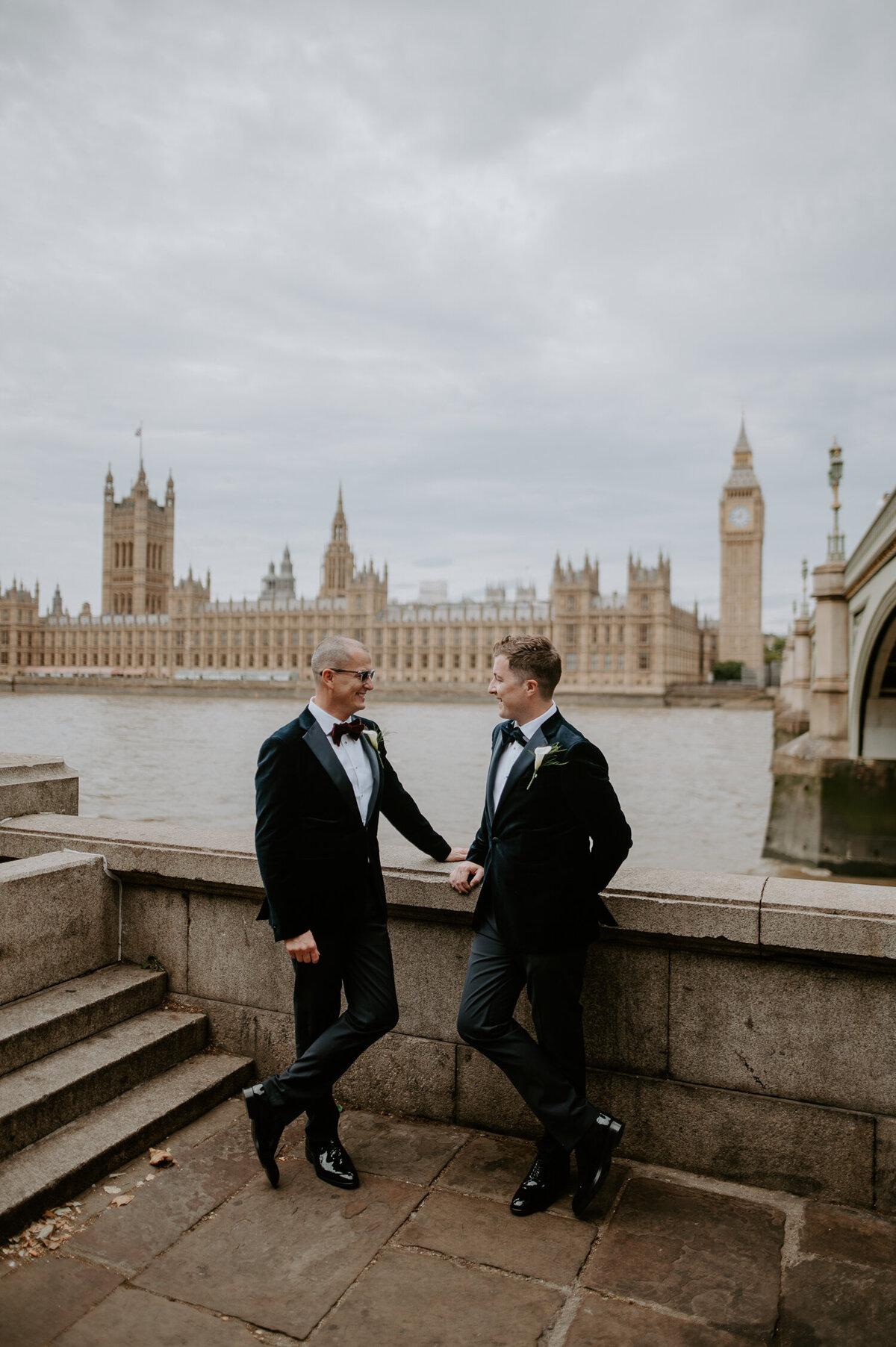 Two grooms have portraits outside the houses of parliament before their wedding ceremony Marylebone Town Hall.