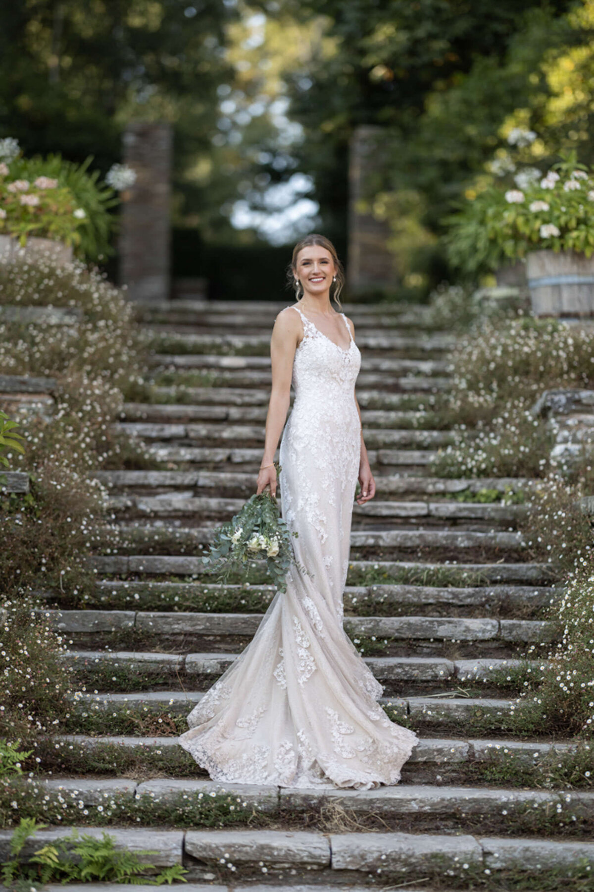 Bride on daisy steps at Hestercombe House Wedding venue