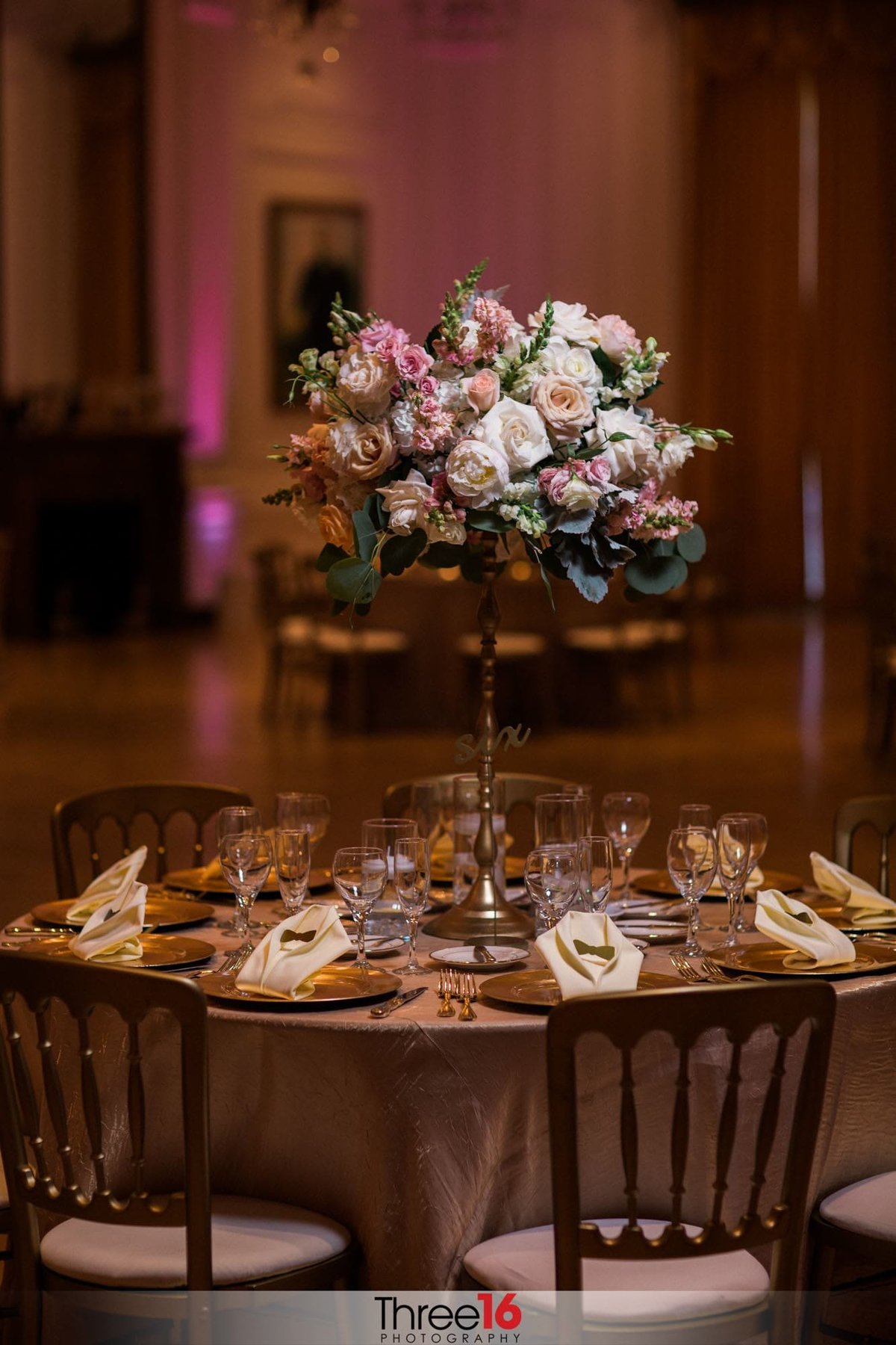 A table setup with centerpiece for wedding reception