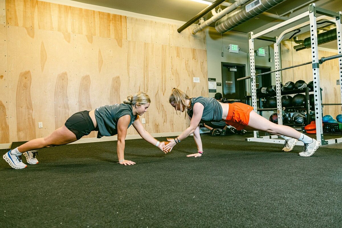 ski academy branding session two students doing pushups