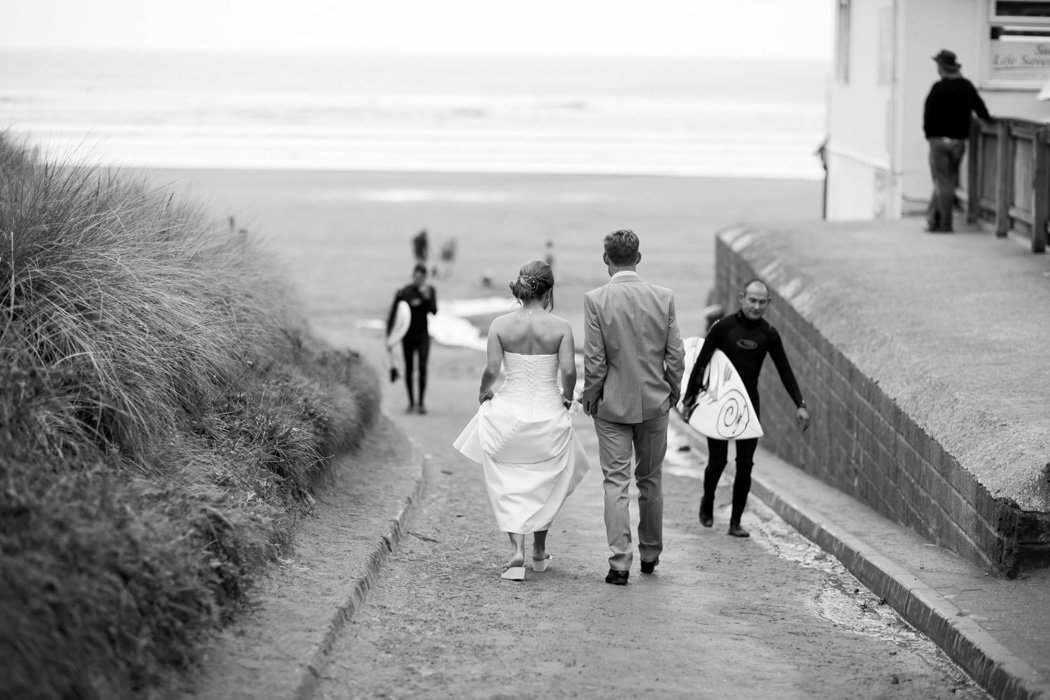 Beach wedding in Cornwall with surfer