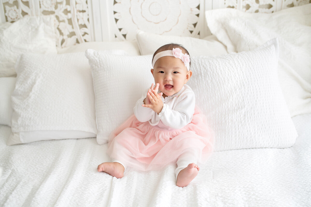 Family session of little girl wearing a bow