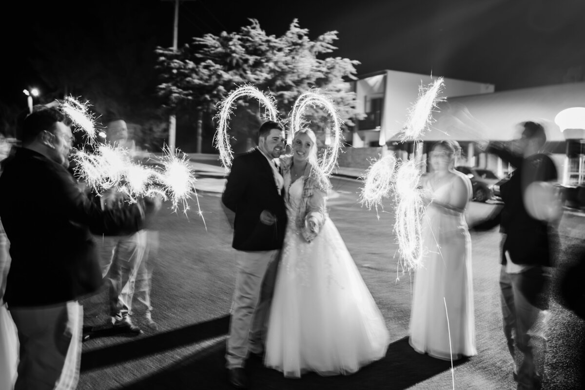 Long exposure photo of a bride and groom with sparklers
