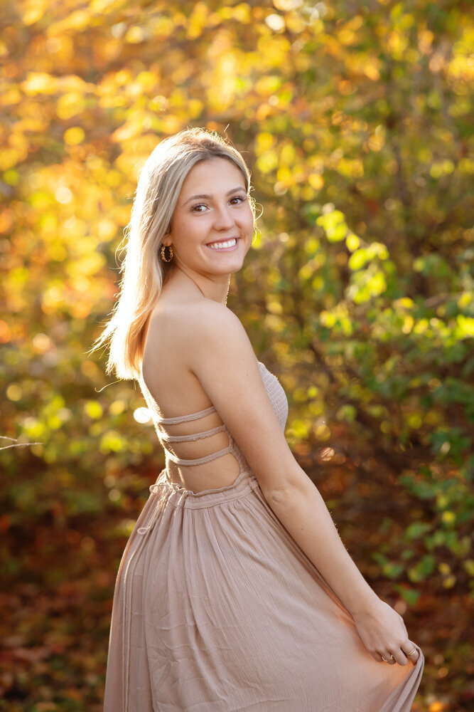 Senior session of young woman posing in dress
