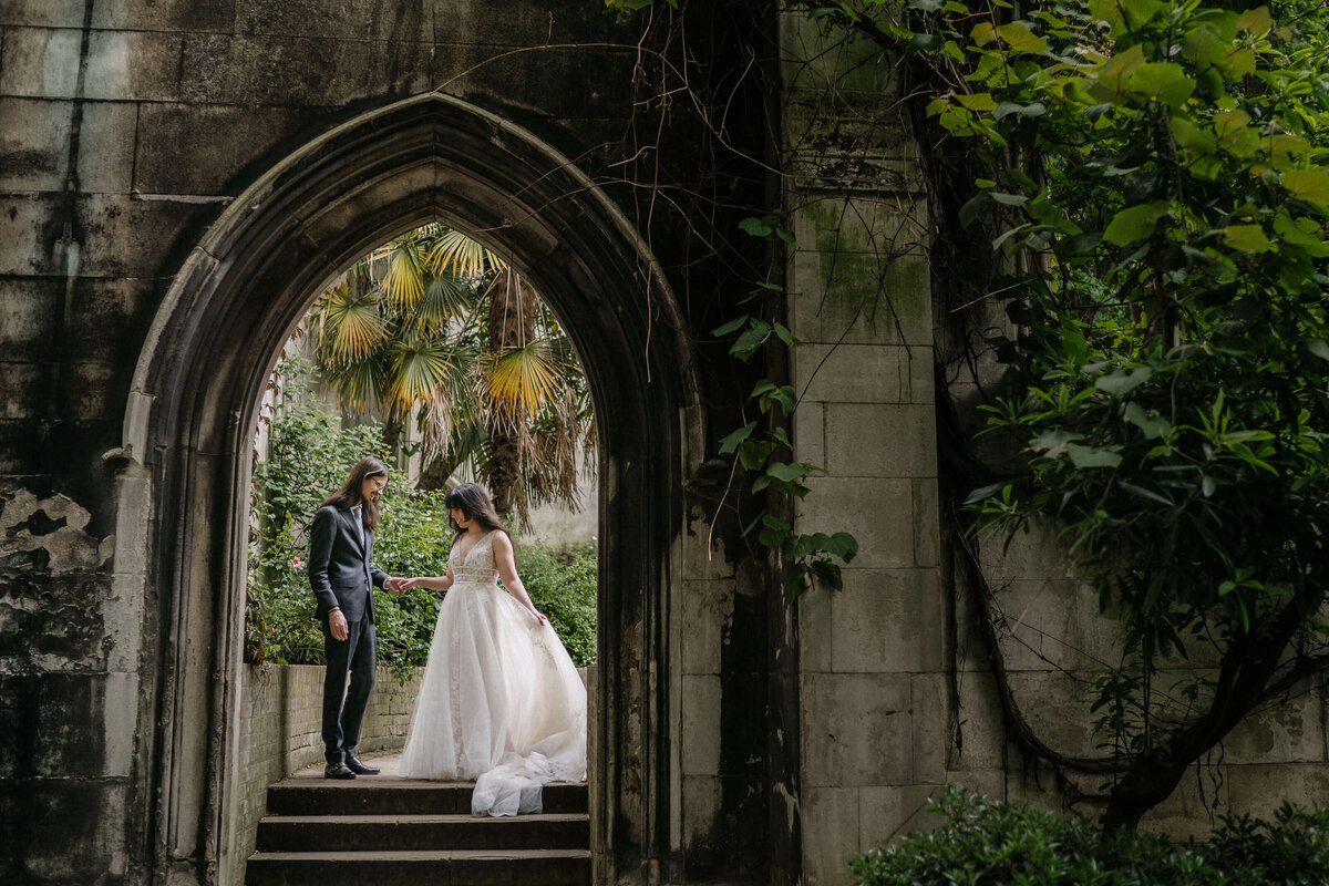 A bride and groom in a Church garden.