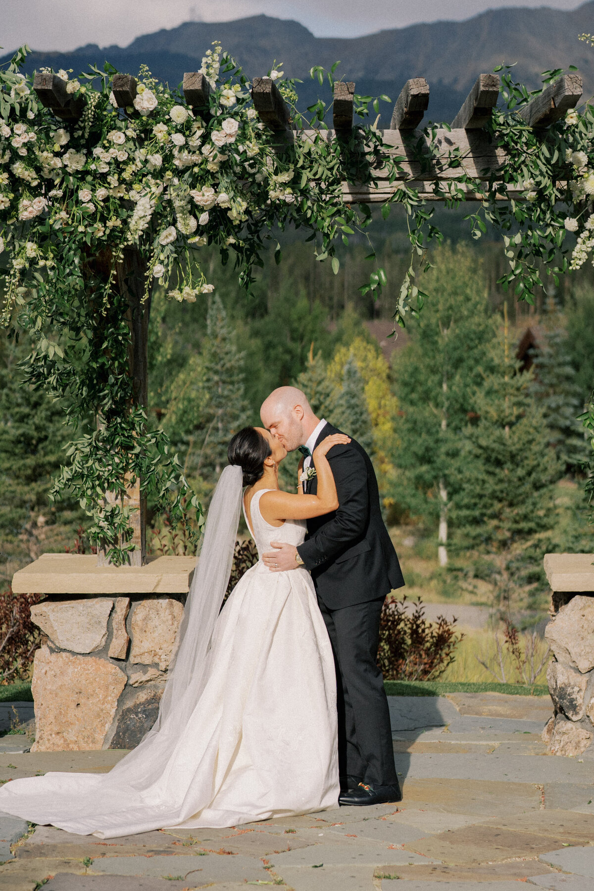 Ceremony kiss at Devils Thumb Ranch wedding