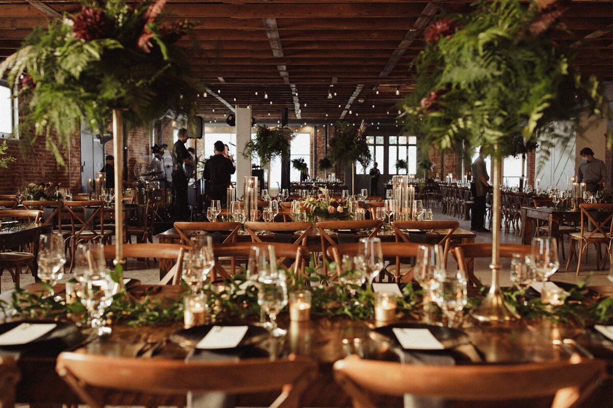 wedding reception with tall greenery and candles at the St Vrain, Longmont wedding venue