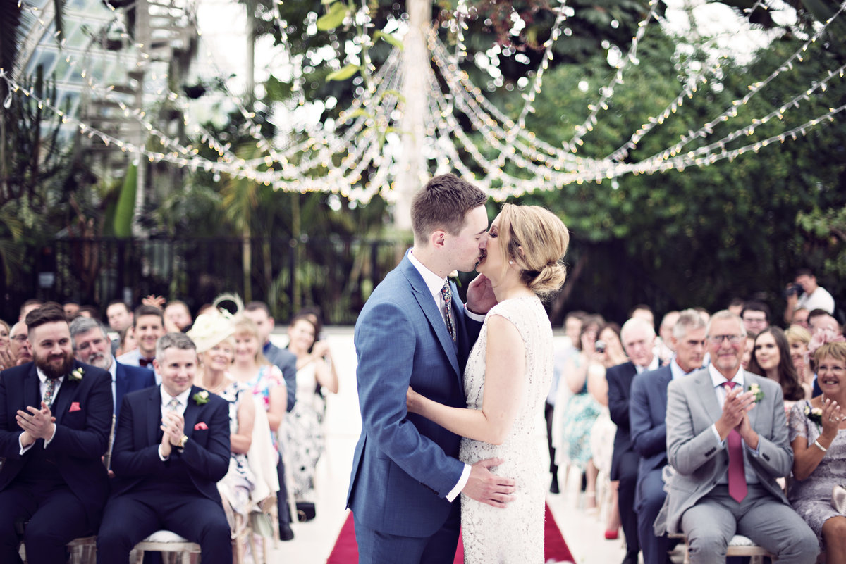 The First Kiss during a ceremony at Sefton Park Palm House