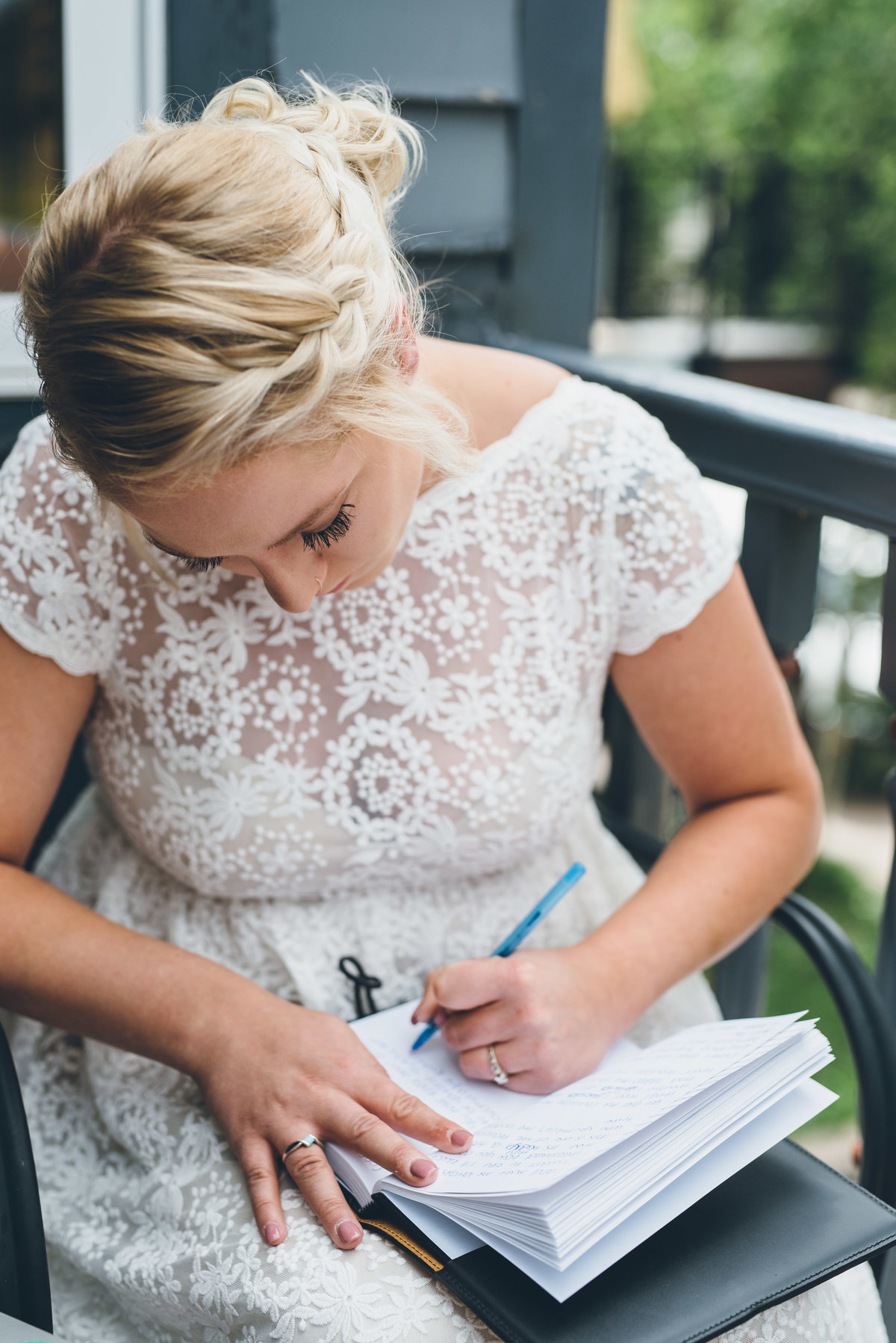 Bride writing her vows on her wedding day