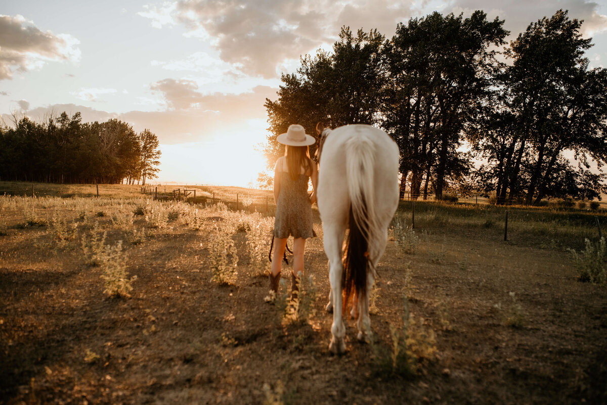 girl walks away with her horse