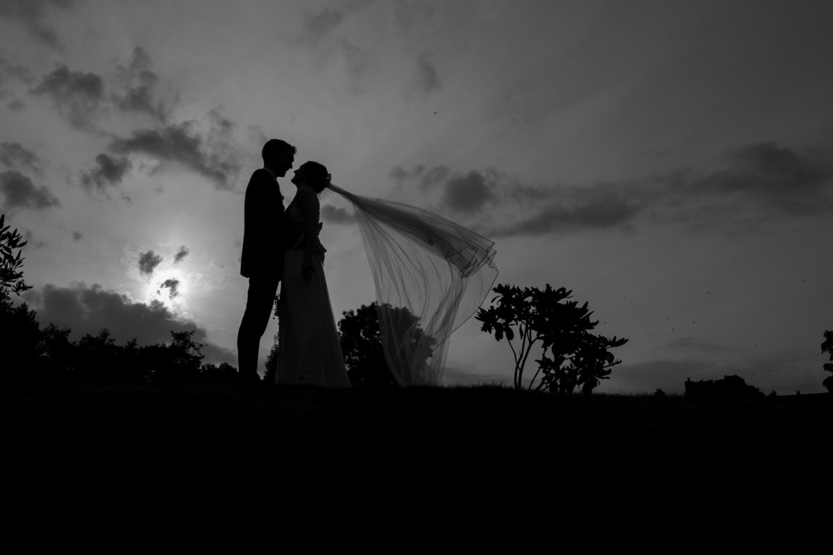 Black and white silhouette of weding couple at Upton Barn in Devon_