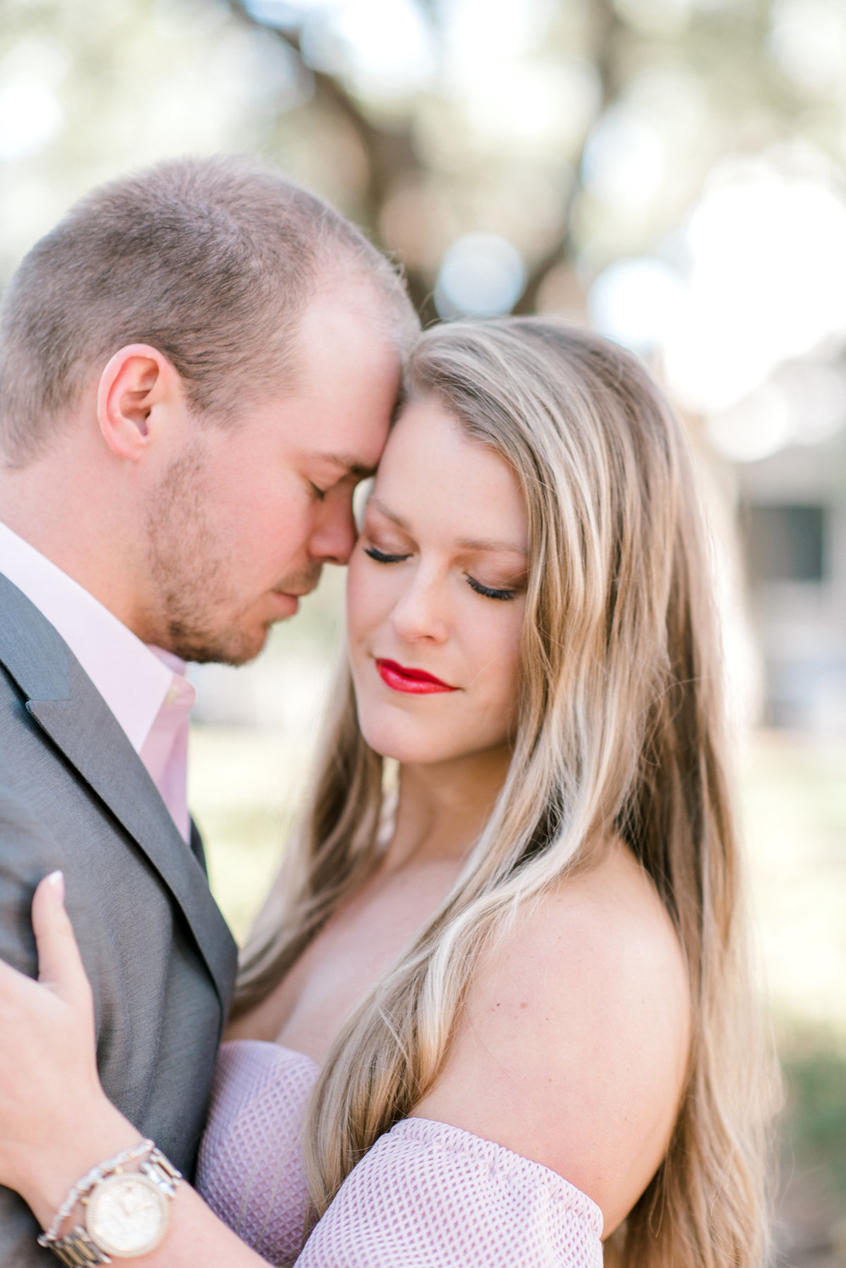 Tender moment between couple during engagement session