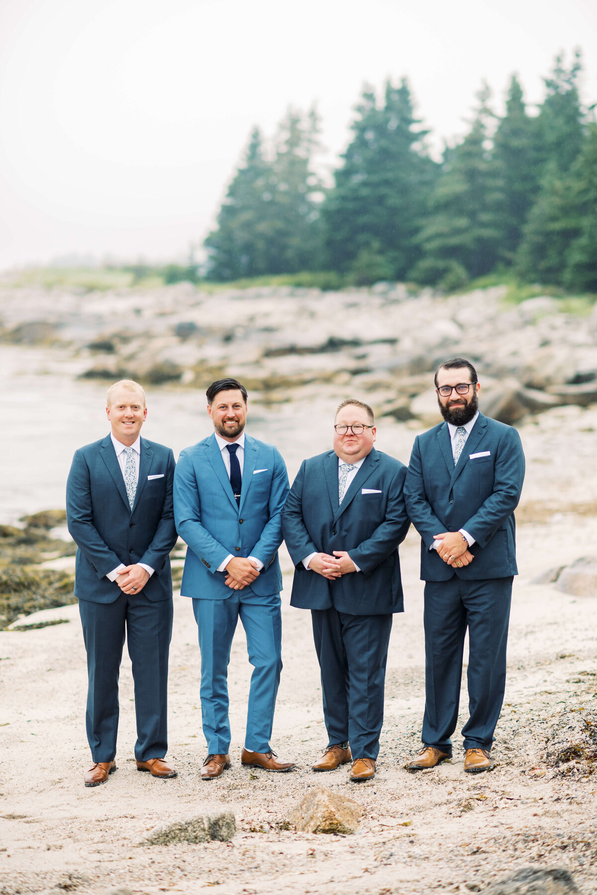 Groom with groomsmen on the beach at Oceanstone Resort Wedding in Nova Scotia