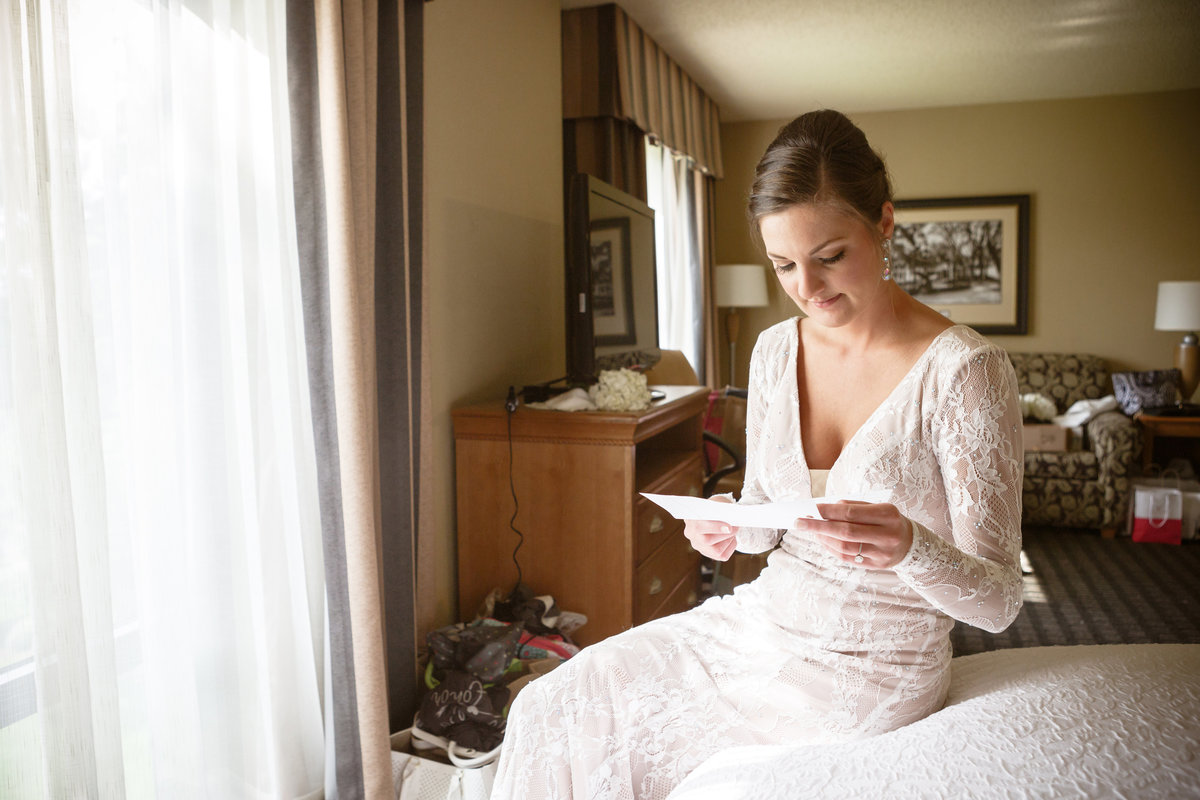 A bride reads a letter from her groom before the wedding ceremony in Mobile, Alabama.