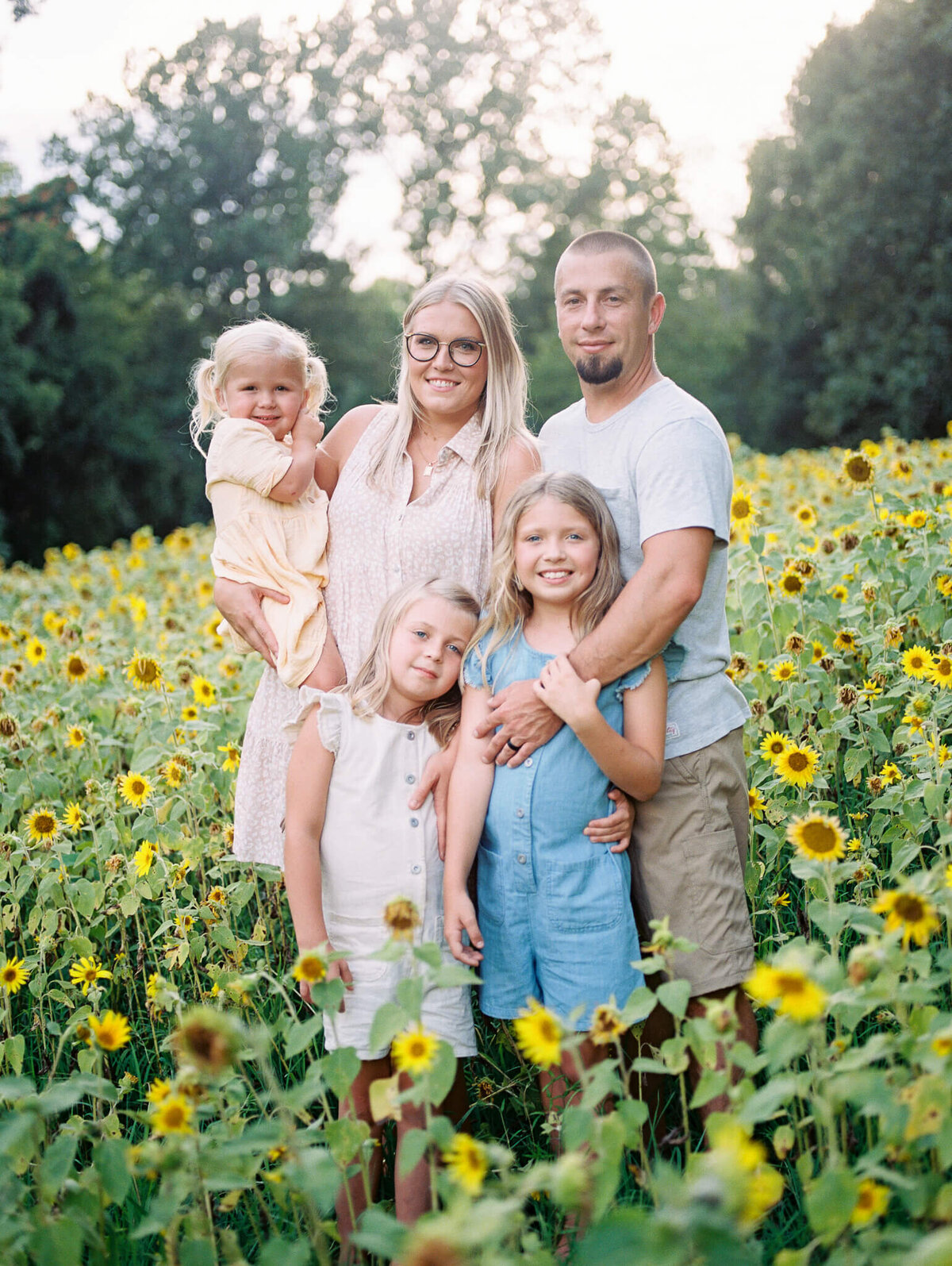 family portrait on film in sunflower field in murray ky