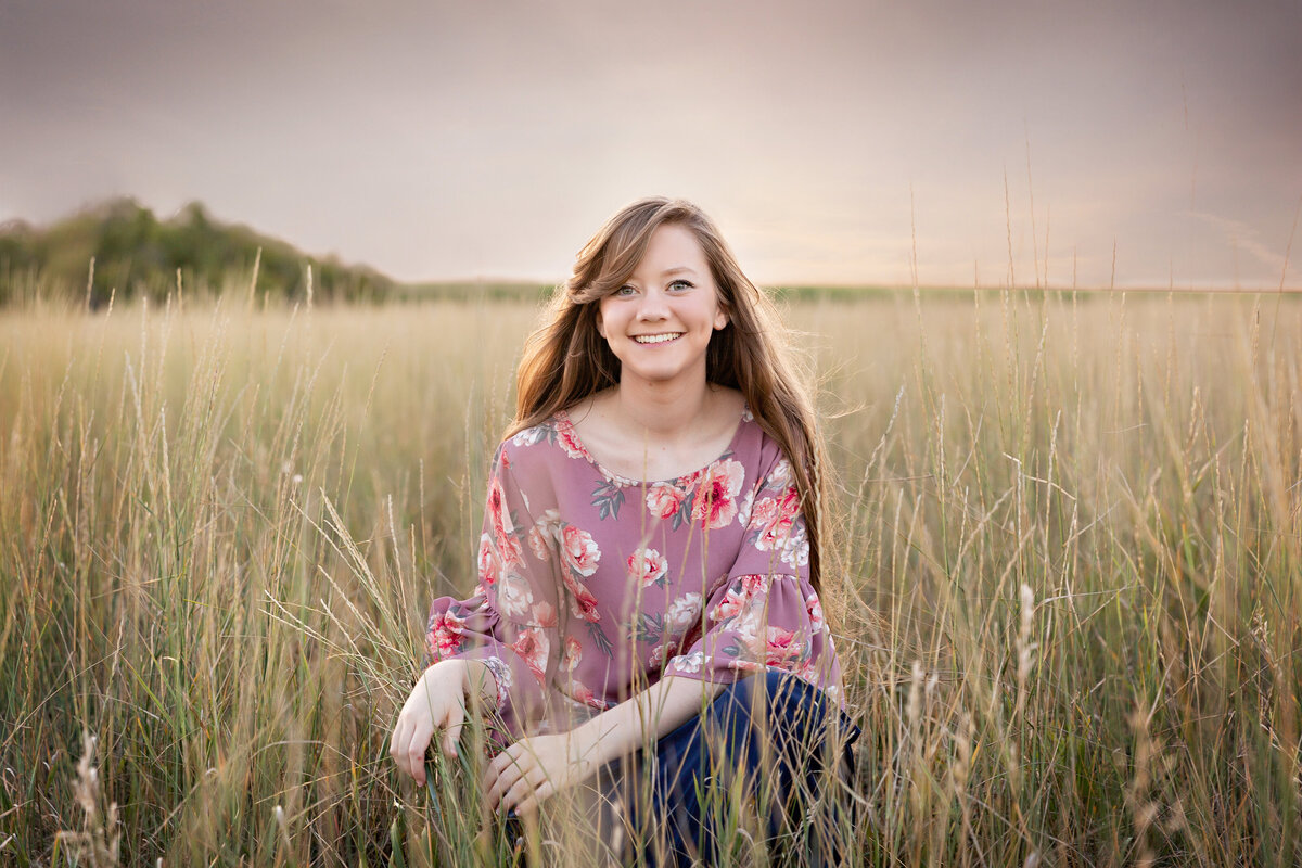 High school senior girl on her farm on the NE plains of Colorado