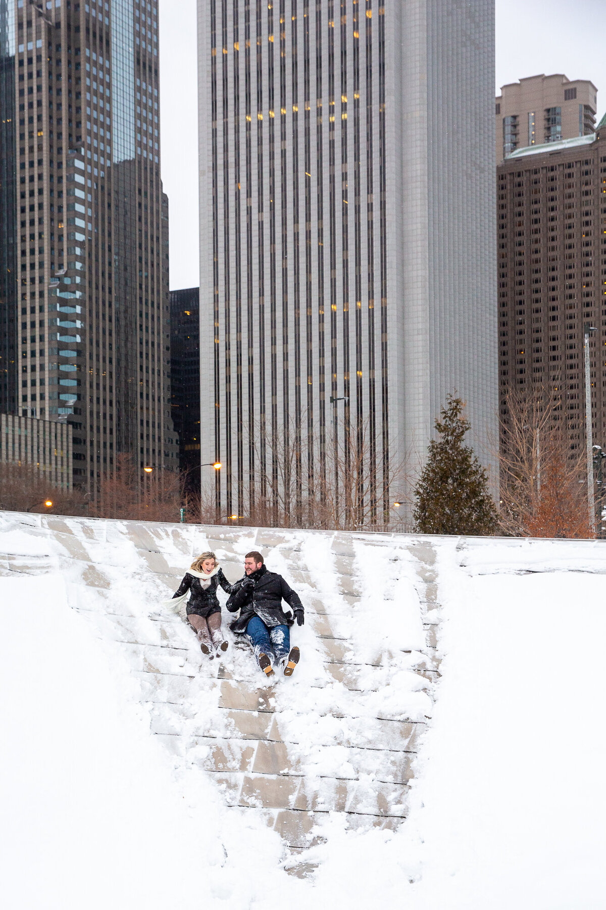 An Chicago city engagement photo session in the winter snow.