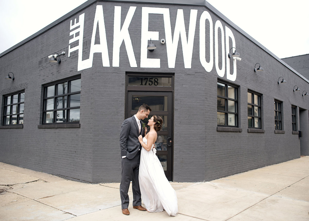 A married couple standing in front of The Lakewood in Chicago Illinois