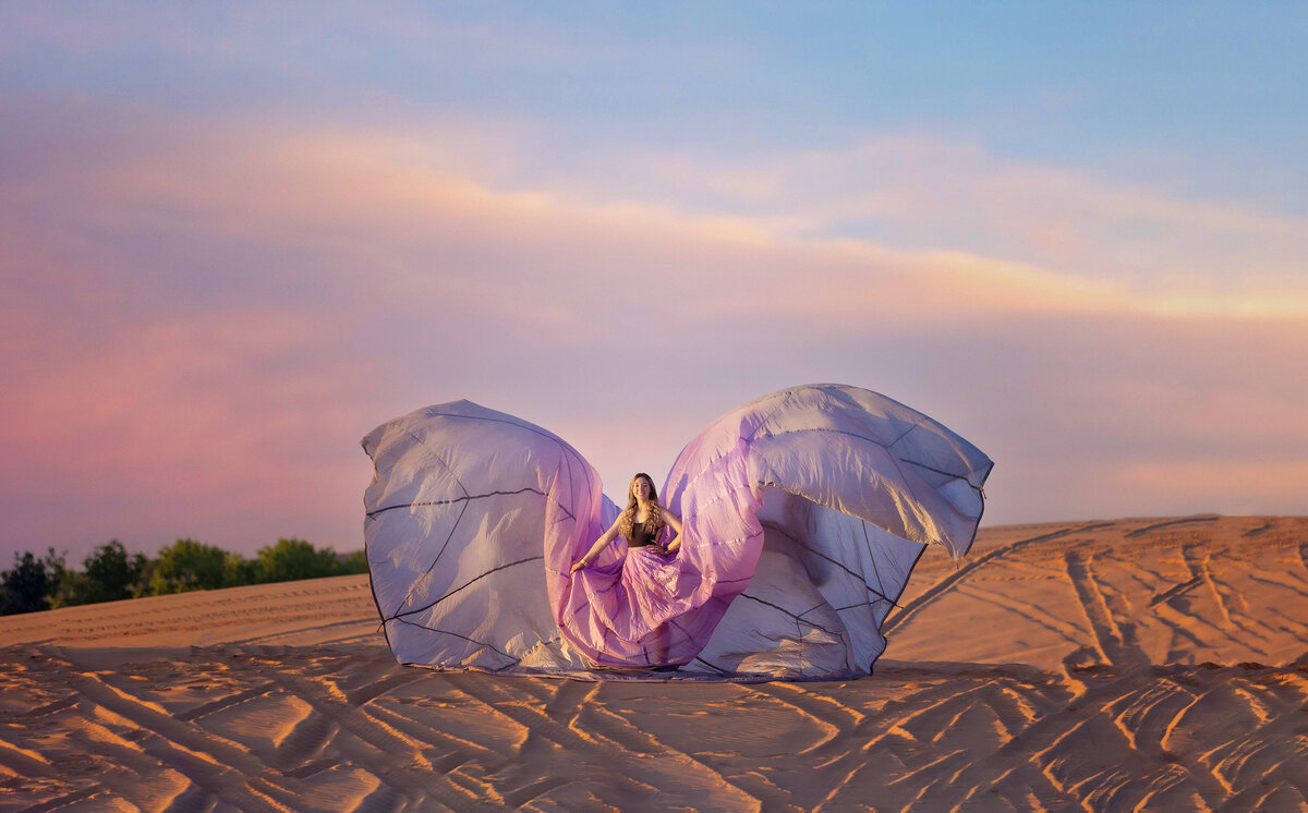 Senior girl wearing a parachute dress at Little Sahara